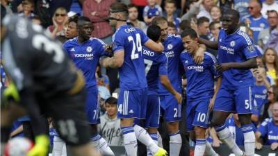 Chelsea's English striker Tammy Abraham (L) celebrates scoring their second goal to take the lead 1-2 during the English Premier League football match between Arsenal and Chelsea at the Emirates Stadium in London on December 29, 2019. (Photo by Adrian DENNIS / AFP) / RESTRICTED TO EDITORIAL USE. No use with unauthorized audio, video, data, fixture lists, club/league logos or 'live' services. Online in-match use limited to 120 images. An additional 40 images may be used in extra time. No video emulation. Social media in-match use limited to 120 images. An additional 40 images may be used in extra time. No use in betting publications, games or single club/league/player publications. /