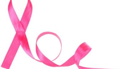 Cropped image of group of young multiracial woman with pink ribbons are struggling against breast cancer. Breast cancer awareness concept.