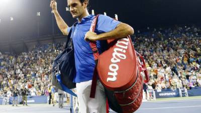 (FILES) In this file photo Switzerland's Roger Federer plays a return to Spain's Rafael Nadal during their tennis match at The Match in Africa at the Cape Town Stadium, in Cape Town on February 7, 2020. - Defending champion Roger Federer has withdrawn from this month's Miami Open as he works his way back to full fitness following surgeries to repair his right knee, US media reported on March 1, 2021. The 39-year-old Swiss star, who has not played since losing in the semi-finals of last year's Australian Open, is due to make his return from a year-long layoff at the Qatar Open in Doha next week. (Photo by RODGER BOSCH / AFP)