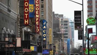 (FILES) In this file photo a view of signage of Broadway plays is seen on March 12, 2020 in New York City. - New York's iconic Broadway theater district will stay closed through the end of the year, its trade association said June 29, 2020, due to the unpredictability of the coronavirus pandemic. The Broadway League did not set a date for performances to resume, but is offering refunds and exchanges for tickets purchased for all shows through January 3, 2021. (Photo by Angela Weiss / AFP)