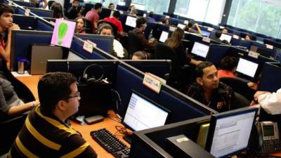An operator works in a call center dedicated to Covid-19 (novel coronavirus) tracing in the N Allo offices in Brussel on May 20, 2020. (Photo by Aris Oikonomou / AFP)