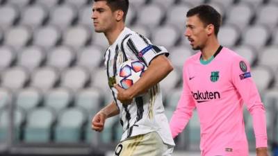Juventus' Spanish forward Alvaro Morata celebrates scoring his team's first goal before it is ruled out by VAR for offside during the UEFA Champions League Group G football match between Juventus and Barcelona on October 28, 2020 at the Juventus stadium in Turin. (Photo by Marco BERTORELLO / AFP)