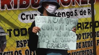 Una mujer pide dinero este miércoles en una calle de Tegucigalpa.