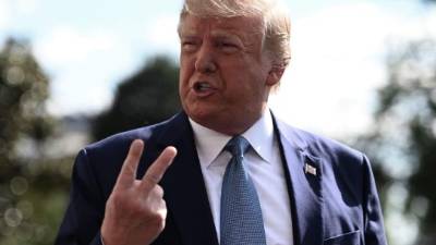 US President Donald Trump speaks to the press as he departs the White House in Washington, DC, for his annual visit to Walter Reed National Military Medical Center, on October 4, 2019. - A defiant Trump refused to confirm Friday that he will cooperate with an impeachment investigation in Congress. 'I don't know, that's up to the lawyers,' he said at the White House. (Photo by Andrew CABALLERO-REYNOLDS / AFP)