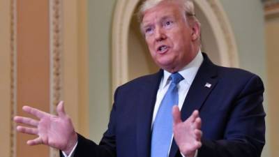 US President Donald Trump speaks with reporters after meeting with Republican Senators on Capitol Hill in Washington, DC on March 10, 2020. (Photo by Nicholas Kamm / AFP)