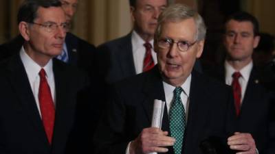WASHINGTON, DC - JANUARY 06: Protesters enter the Senate Chamber on January 06, 2021 in Washington, DC. Congress held a joint session today to ratify President-elect Joe Biden's 306-232 Electoral College win over President Donald Trump. Pro-Trump protesters have entered the U.S. Capitol building after mass demonstrations in the nation's capital. Win McNamee/Getty Images/AFP