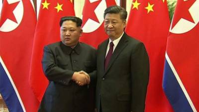Kim Jong Un con el presidente chino, Xi Jinping.