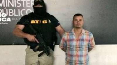 El policía cuando fue capturado en 2019.