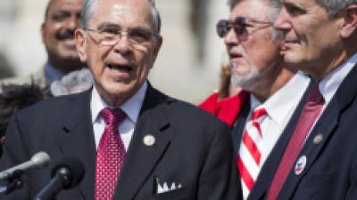 UNITED STATES - SEPTEMBER 14: Rep. Ruben Hinojosa, D-Texas, left, speaks as Rep. Lloyd Doggett, D-Texas, looks on during a news conference on Friday, Sept. 14, 2012, in advance of the Lincoln Memorial 'Freedom Rally,' scheduled September 15, which is calling on comprehensive immigration reform and passage of the DREAM Act. (Photo By Bill Clark/CQ Roll Call)