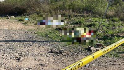 Escena del hallazgo donde fueron encontrados los cuerpos sin vida de Jafeth y Brayan Hernández, en la salida al sur de Tegucigalpa, capital de Honduras.