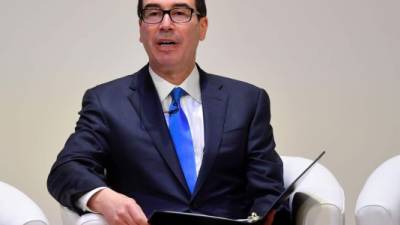 (FILES) In this file photo taken on February 28, 2019 US Treasury Secretary Steven Mnuchin speaks at the Jordan Growth and Opportunity Conference in London. - The US Treasury slapped sanctions March 11, 2019 on a Russia-based bank partly owned by Venezuela for its support for the government of embattled President Nicolas Maduro and the state oil company PDVSA. The sanctions were aimed at Moscow-based Evrofinance Mosnarbank, which when founded in 2011 was 50 percent-owned by leading Russian banks and 49-percent owned by Venezuela's National Development Fund.'This action demonstrates that the United States will take action against foreign financial institutions that sustain the illegitimate Maduro regime and contribute to the economic collapse and humanitarian crisis plaguing the people of Venezuela,' said Treasury Secretary Steven Mnuchin in a statement. (Photo by TOBY MELVILLE / POOL / AFP)