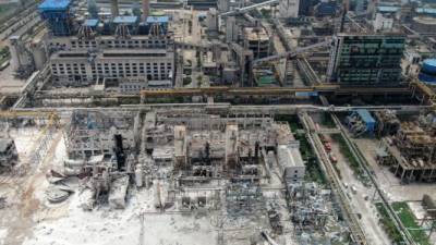 Damaged buildings are seen at the site of an explosion at the Henan Coal Gas Group factory in Yima city, in China's central Henan province on July 20, 2019. - The death toll from a huge explosion that rocked a gas plant in central China rose to 10, state media said on July 20, with five people still missing. Friday's blast at the Henan Coal Gas Group factory left another 19 people seriously injured and more with light injuries, said state broadcaster CCTV. (Photo by - / AFP) / China OUT