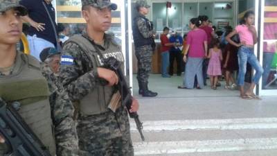 (FILES) This file photo taken on March 08, 2017 shows a NHS (National Health Service) sign pictured outside St Thomas' Hospital in central London.Several British hospitals were hit by a cyber attack on May 12, 2017, the country's National Health Service said, forcing some to cancel routine appointments. 'A number of NHS organisations have reported to NHS Digital that they have been affected by a ransomware attack,' the public health service said in a statement. / AFP PHOTO / BEN STANSALL