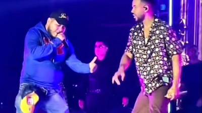 El hondureño Ramses y el cantante Romeo Santos.