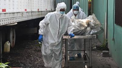 Cuerpos de las reclusas fallecidas llegando a la morgue de Tegucigalpa.