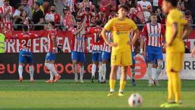 Los jugadores del Girona celebrando el primer gol de Portu contra el Barcelona.