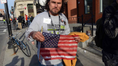 BOSTON, MA - APRIL 15: Carlos Arredondo, who was at the finish line of the 117th Boston Marathon when two explosives detonated, leaves the scene on April 15, 2013 in Boston, Massachusetts. Two people are confirmed dead and at least 28 injured after at least two explosions went off near the finish line to the marathon. Darren McCollester/Getty Images/AFP== FOR NEWSPAPERS, INTERNET, TELCOS & TELEVISION USE ONLY ==