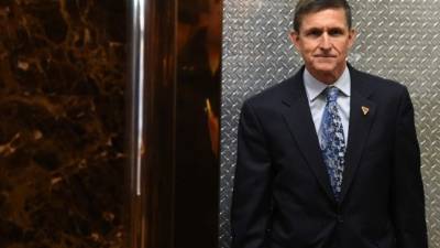 (FILES): This file photo taken on January 04, 2017 shows Michael Flynn, then National Security Advisor designate, arriving at Trump Tower for meetings with US President-elect Donald Trump in New York.The White House announced February 13, 2017 that Michael Flynn has resigned as President Donald Trump's national security advisor, amid escalating controversy over his contacts with Moscow. In his formal resignation letter, Flynn acknowledged that in the period leading up to Trump's inauguration: 'I inadvertently briefed the vice president-elect and others with incomplete information regarding my phone calls with the Russian ambassador.'Trump has named retired lieutenant general Joseph Kellogg, who was serving as a director on the Joint Chiefs of Staff, as acting national security advisor, the White House said. / AFP PHOTO / TIMOTHY A. CLARY