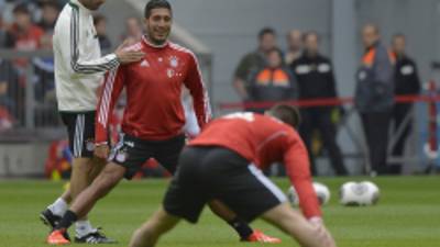 (FILES) This picture taken on June 26, 2013 shows German first division Bundesliga football club Bayern Munich's new Spanish head coach Pep Guardiola (L) talk with midfielder Emre Can (2nd L) during his first training session with the club in Munich, southern Germany. Germany Under-21 midfielder Emre Can has left European champions Bayern Munich to sign a four-year deal with Bayer Leverkusen, both clubs confirmed on Friday, August 2, 2013. AFP PHOTO / GUENTER SCHIFFMANN
