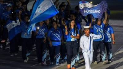 Athletes from Honduras parade during the 2018 Central American and Caribbean Games (CAC) opening ceremony in Barranquilla, Colombia, on July 19, 2018. The games will be held between July 19 and August 03, with more than 5,000 athletes from 37 countries taking part. / AFP PHOTO / LUIS ACOSTA