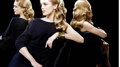 Un efecto tipo Rita Hayworth, con una cascada de rizos logrados con tubo y plancha agrega un toque de sofisticación a cualquier mujer.