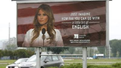Cars drive behind a huge advert poster of the 'American Institute' promoting its English language courses with a photo of US First Lady Melania Trump, in downtown Zagreb, Croatia. EFE
