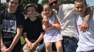 David Beckham y sus hijos.