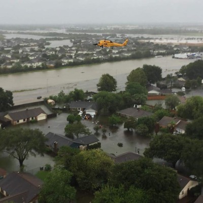 This US Coast Guard photo obtained August 31, 2017 shows an MH-60T Jayhawk helicopter conducting search and rescue operations during the aftermath of Hurricane Harvey above the greater Houston Metro Area on August 29, 2017. The Coast Guard has deployed assets and resources from across the country to create a sustainable response force. / AFP PHOTO / US Coast Guard / Handout / RESTRICTED TO EDITORIAL USE - MANDATORY CREDIT 'AFP PHOTO / US COAST/ GUARD/HANDOUT' - NO MARKETING NO ADVERTISING CAMPAIGNS - DISTRIBUTED AS A SERVICE TO CLIENTS