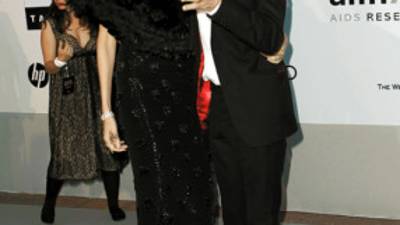 **CORRECTS NAME OF WOMAN** Mick Jagger, left, and L'Wren Scott arrive for the amfAR Cinema Against AIDS benefit at the Hotel du Cap-Eden-Roc, during the 63rd Cannes international film festival, in Cap d'Antibes, southern France, Thursday, May 20, 2010. (AP Photo/Matt Sayles)