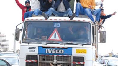 Volunteer residents carrying the flag of Libya's monarchy prior to Moammar Gadhafi's reign, and offering to help in providing municipal services such as cleaning, ride on a truck in Benghazi, Libya Wednesday, Feb. 23, 2011. (AP Photo/Alaguri)