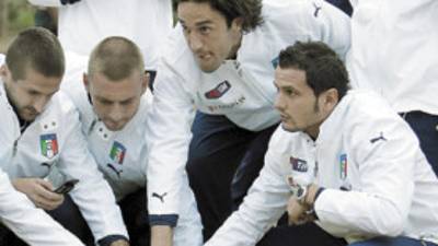 Italy's players pet a lion cub during a visit at the Lion Park in Randburg, South Africa, Tuesday, June 16, 2009. Italy will play Egypt in a Confederations Cup soccer match on Thursday. (AP Photo/Antonio Calanni)