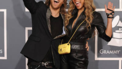 LOS ANGELES, CA - FEBRUARY 12: DJ David Guetta (L) and his wife Cathy Guetta arrive at The 54th Annual GRAMMY Awards at Staples Center on February 12, 2012 in Los Angeles, California. (Photo by Steve Granitz/WireImage)