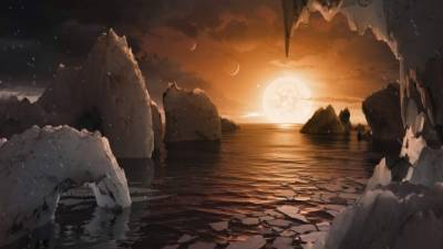 La NASA publicó este concepto artístico de cómo podría ser la superficie del exoplaneta TRAPPIST-1f, localizado en el sistema TRAPPIST-1.