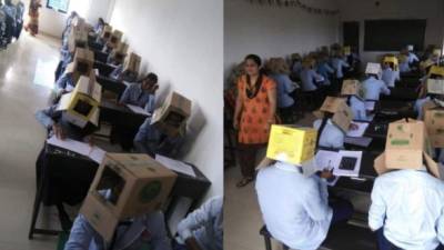 Las cajas de cartón tenían un agujero en la parte frontal para que los alumnos pudiesen ver solo la hoja del examen.