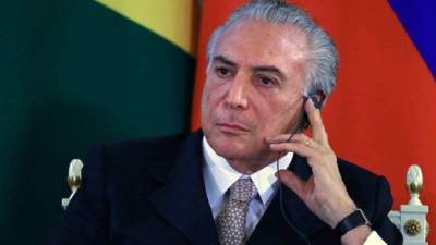 (FILES) In this file photo taken on June 07, 2017 Brazilian President Michel Temer gestures as he attends a ceremony to launch the Agricultural and Livestock Plan 2017/2018 at Planalto Palace in Brasilia, Brazil. - An appeals court in Rio de Janeiro decided on May 8, 2019 that former Brazilian President Michel Temer, who faces accusations of corruption, must return to jail and the decision 'has immediate effect,' a court adviser confirmed to AFP. Temer had been provisionally imprisoned at the end of March but released a few days later by order of an appeals judge, whose decision was reverted today. (Photo by EVARISTO SA / AFP)