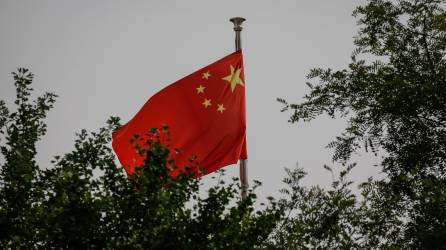 Bandera de China ondeando | Fotografía de archivo