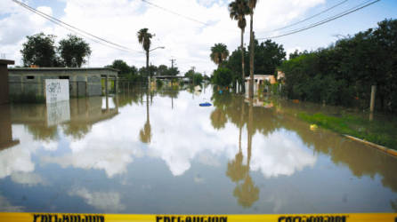 Flooded houses are seen in Ciudad Anahuac, in the Mexican northeastern state of Nuevo Leon, Wednesday, July 7, 2010. About 18,000 people were evacuated Tuesday from Ciudad Anahuac, where authorities opened a dam's floodgates for fear it would overflow from rains that accompanied Hurricane Alex. (AP Photo/Miguel Tovar)