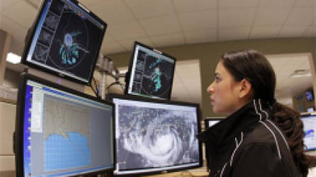Meteorologist Monica Bozeman tracks Tropical Storm Isaac at the National Hurricane Center in Miami, Tuesday, Aug. 28, 2012. Forecasters at the National Hurricane Center warned that Isaac, especially if it strikes at high tide, could cause storm surges of up to 12 feet (3.6 meters) along the coasts of southeast Louisiana and Mississippi and up to 6 feet (1.8 meters) as far away as the Florida Panhandle. (AP Photo/Alan Diaz)