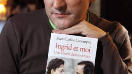 Juan Carlos Lecompte, former husband of French-Colombian politician Ingrid Betancourt, poses with his book 'Ingrid and me, A bitter-sweet freedom' during an interview with Reuters in Paris January 27, 2010. REUTERS/Charles Platiau (FRANCE - Tags: POLITICS SOCIETY)