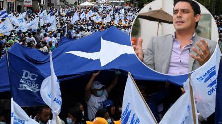 Simpatizantes del candidato a la presidencia de Honduras por el gobernante Partido Nacional, Nasry Asfura, más conocido como “Papi a la Orden”, participando en un mitin de campaña