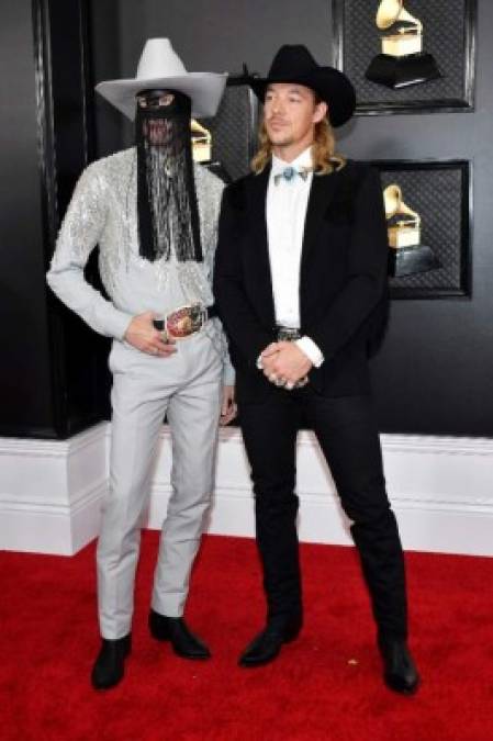 LOS ANGELES, CALIFORNIA - JANUARY 26: (L-R) Orville Peck and Diplo attend the 62nd Annual GRAMMY Awards at Staples Center on January 26, 2020 in Los Angeles, California. Amy Sussman/Getty Images/AFP