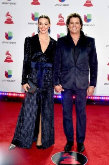 LAS VEGAS, NV - NOVEMBER 15: Carlos Vives (R) and Claudia Elena Vasquez attend the 19th annual Latin GRAMMY Awards at MGM Grand Garden Arena on November 15, 2018 in Las Vegas, Nevada. David Becker/Getty Images for LARAS/AFP