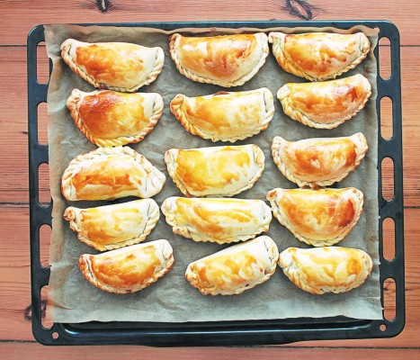 fresh empanadas - traditional food on baking tray