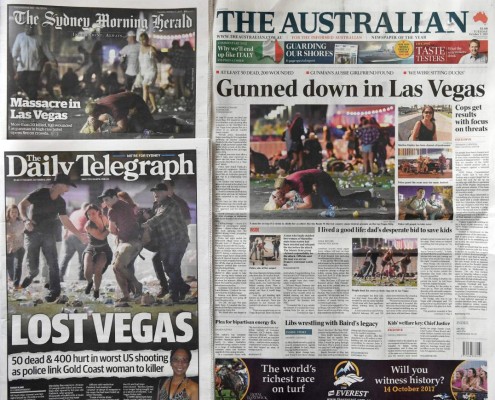 A photo taken on October 3, 2017, shows the front pages of Australian newspapers in Sydney, headlining the news of the massacre in Las Vegas.At least 59 people were killed and hundreds wounded on October 2, 2017 when a gunman opened fire on a concert in Las Vegas in the deadliest mass shooting in modern US history. / AFP PHOTO / WILLIAM WEST