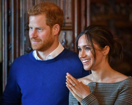 The Ascot Landau open carriage, which will be used in the case of dry weather, for the wedding of Britain's Prince Harry and Meghan Markle, stands ready in the Royal Mews at Buckingham Palace in London, Tuesday May 1, 2018. Prince Harry and Meghan Markle will tie the knot at St. George's Chapel in Windsor, southern England on May 19, with about 600 guests and some 2,600 neighbours, staff and specially selected members of the public greeting the happy couple outside the chapel. The Scottish State Coach will be used in the case of wet weather. (Victoria Jones/Pool via AP)