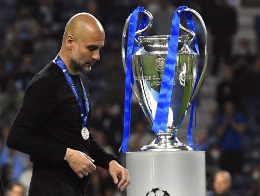 Porto (Portugal), 29/05/2021.- Manchester City manager Pep Guardiola reacts after the UEFA Champions League final between Manchester City and Chelsea FC in Porto, Portugal, 29 May 2021. (Liga de Campeones) EFE/EPA/Pierre-Philippe Marcou / POOL