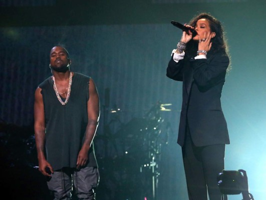 GLENDALE, AZ - JANUARY 31: Recording artists Kanye West (L) and Rihanna perform onstage during DirecTV Super Saturday Night hosted by Mark Cuban's AXS TV and Pro Football Hall of Famer Michael Strahan at Pendergast Family Farm on January 31, 2015 in Glendale, Arizona. (Photo by Christopher Polk/Getty Images for DirecTV)