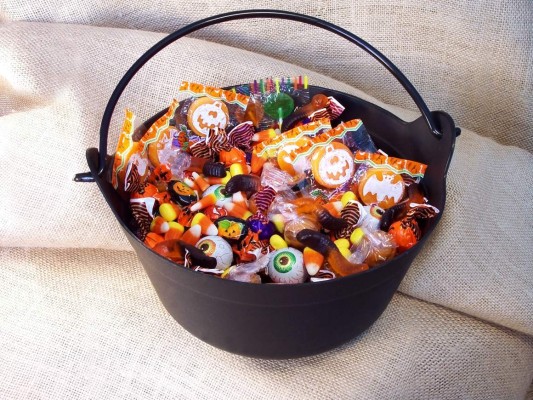 Halloween candy in a plastic witches cauldron.