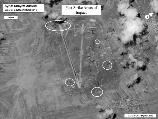 This satellite photo courtesy of the Department of Defense shows a battle damage assessment image of Shayrat Airfield, Syria,following US Tomahawk Land Attack Missile strikes on April 7, 2017 from the USS Ross (DDG 71) and USS Porter (DDG 78), Arleigh Burke-classguided-missile destroyers. The United States fired Tomahawk missiles into Syria in retaliation for the regime of Bashar Assad using nerve agents to attack his own people. / AFP PHOTO / DoD / Handout / RESTRICTED TO EDITORIAL USE - MANDATORY CREDIT AFP PHOTO /DOD - NO MARKETING - NO ADVERTISING CAMPAIGNS - DISTRIBUTED AS A SERVICE TO CLIENTS