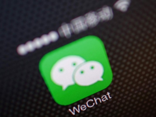 WASHINGTON, DC - AUGUST 07: In this photo illustration, the WeChat app is displayed in the App Store on an Apple iPhone on August 7, 2020 in Washington, DC. On Thursday evening, President Donald Trump signed an executive order that bans any transactions between the parent company of TikTok, ByteDance, and U.S. citizens due to national security reasons. The president signed a separate executive order banning transactions with China-based tech company Tencent, which owns the app WeChat. Both orders are set to take effect in 45 days. (Photo Illustration by Drew Angerer/Getty Images)